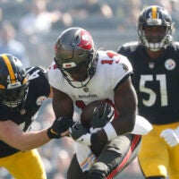 Oct 16, 2022; Pittsburgh, Pennsylvania, USA; Tampa Bay Buccaneers wide receiver Chris Godwin (14) makes a catch as Pittsburgh Steelers linebacker Robert Spillane (41) defends during the first quarter at Acrisure Stadium.