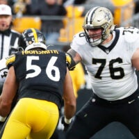 Nov 13, 2022; Pittsburgh, Pennsylvania, USA; New Orleans Saints offensive tackle Calvin Throckmorton (76) blocks at the line of scrimmage against Pittsburgh Steelers linebacker Alex Highsmith (56) during the third quarter at Acrisure Stadium.