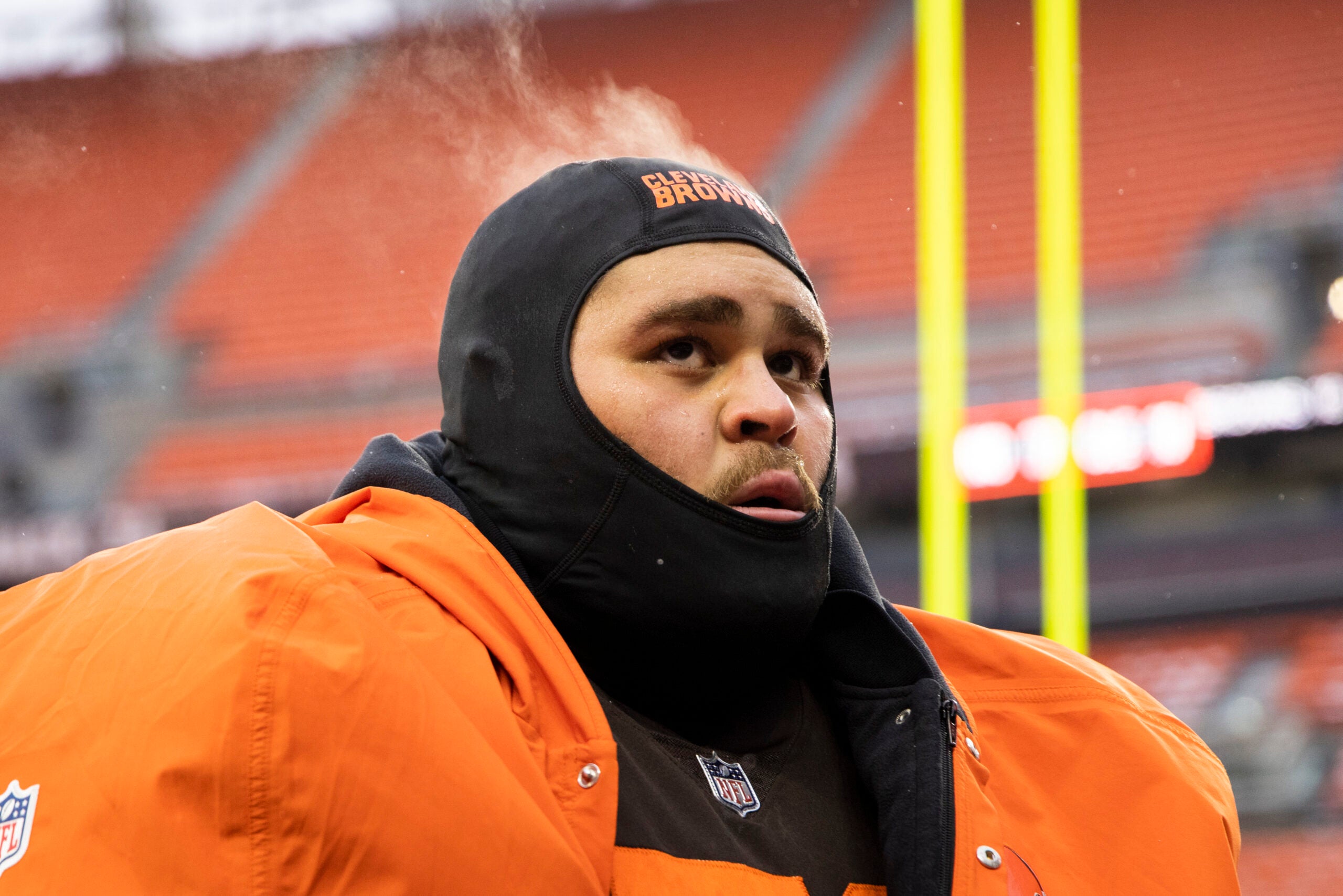 Dec 24, 2022; Cleveland, Ohio, USA; Steam comes off the head of Cleveland Browns offensive tackle Jedrick Wills Jr. (71) as he walks off the field following the game against the New Orleans Saints at FirstEnergy Stadium.