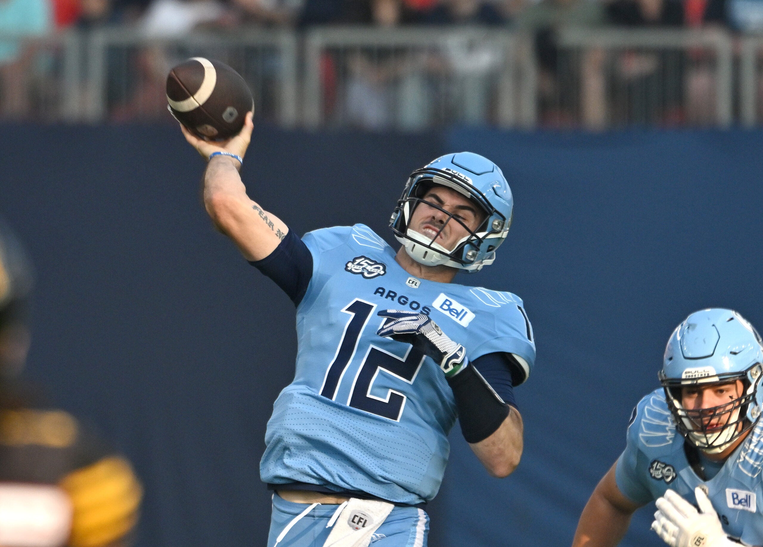 Jun 18, 2023; Toronto, Ontario, CAN; Toronto Argonauts quarterback Chad Kelly (12) throws a pass against the Hamilton Tiger-Cats in the first quarter at BMO Field.