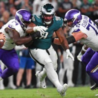 Sep 14, 2023; Philadelphia, Pennsylvania, USA; Philadelphia Eagles defensive tackle Jalen Carter (98) is blocked by Minnesota Vikings offensive tackle Olisaemeka Udoh (74) and guard Ezra Cleveland (72) at Lincoln Financial Field.