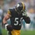 Pittsburgh Steelers Cole Holcomb pulls dirt out of his helmet after recovering a fumble during the first half against the Jacksonville Jaguars at Acrisure Stadium in Pittsburgh, PA on October 29, 2023.