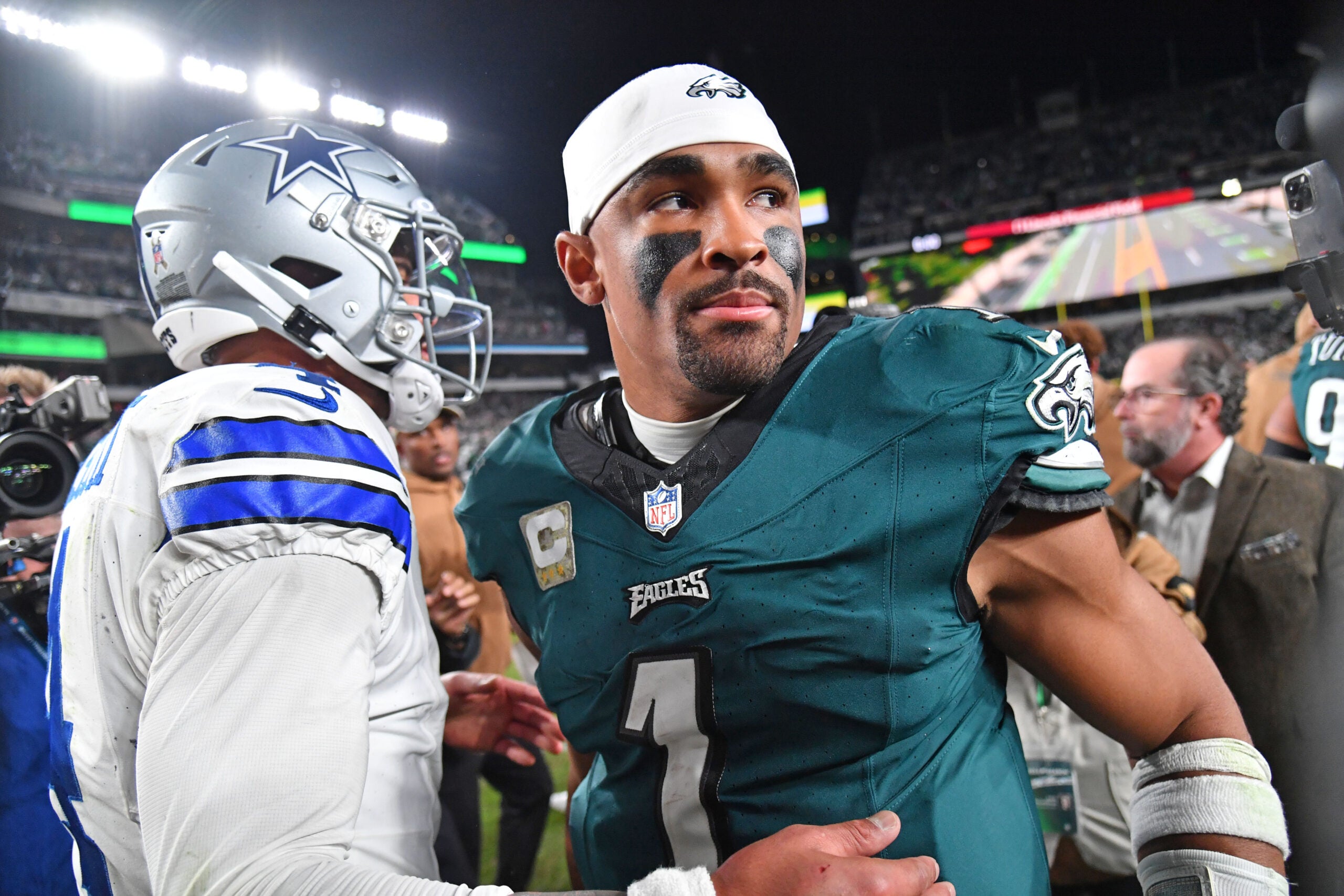 Nov 5, 2023; Philadelphia, Pennsylvania, USA; Dallas Cowboys quarterback Dak Prescott (4) and Philadelphia Eagles quarterback Jalen Hurts (1) meet on the field after Eagles win at Lincoln Financial Field.
