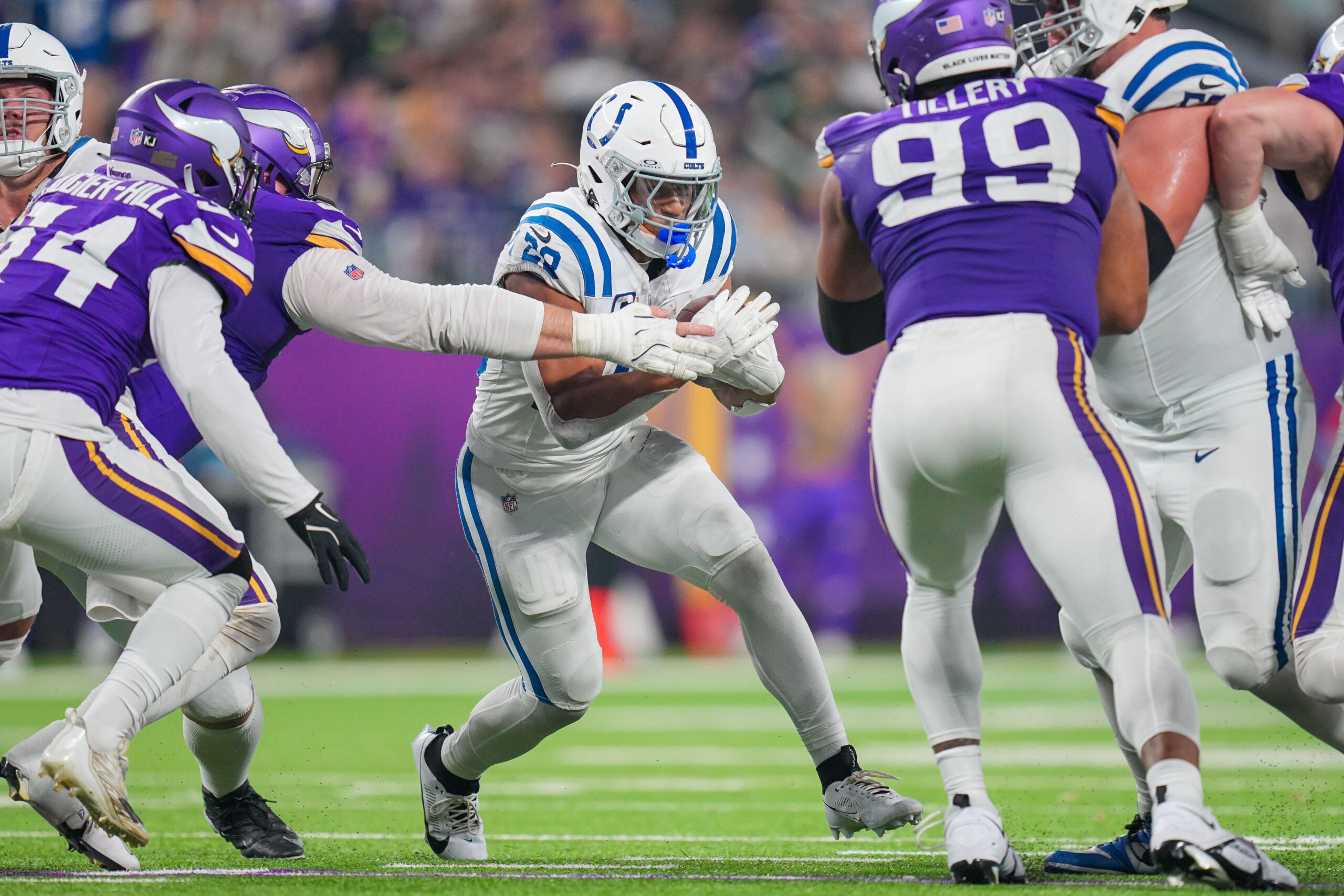 Nov 3, 2024; Minneapolis, Minnesota, USA; Indianapolis Colts running back Jonathan Taylor (28) runs with the ball against the Minnesota Vikings in the fourth quarter at U.S. Bank Stadium.