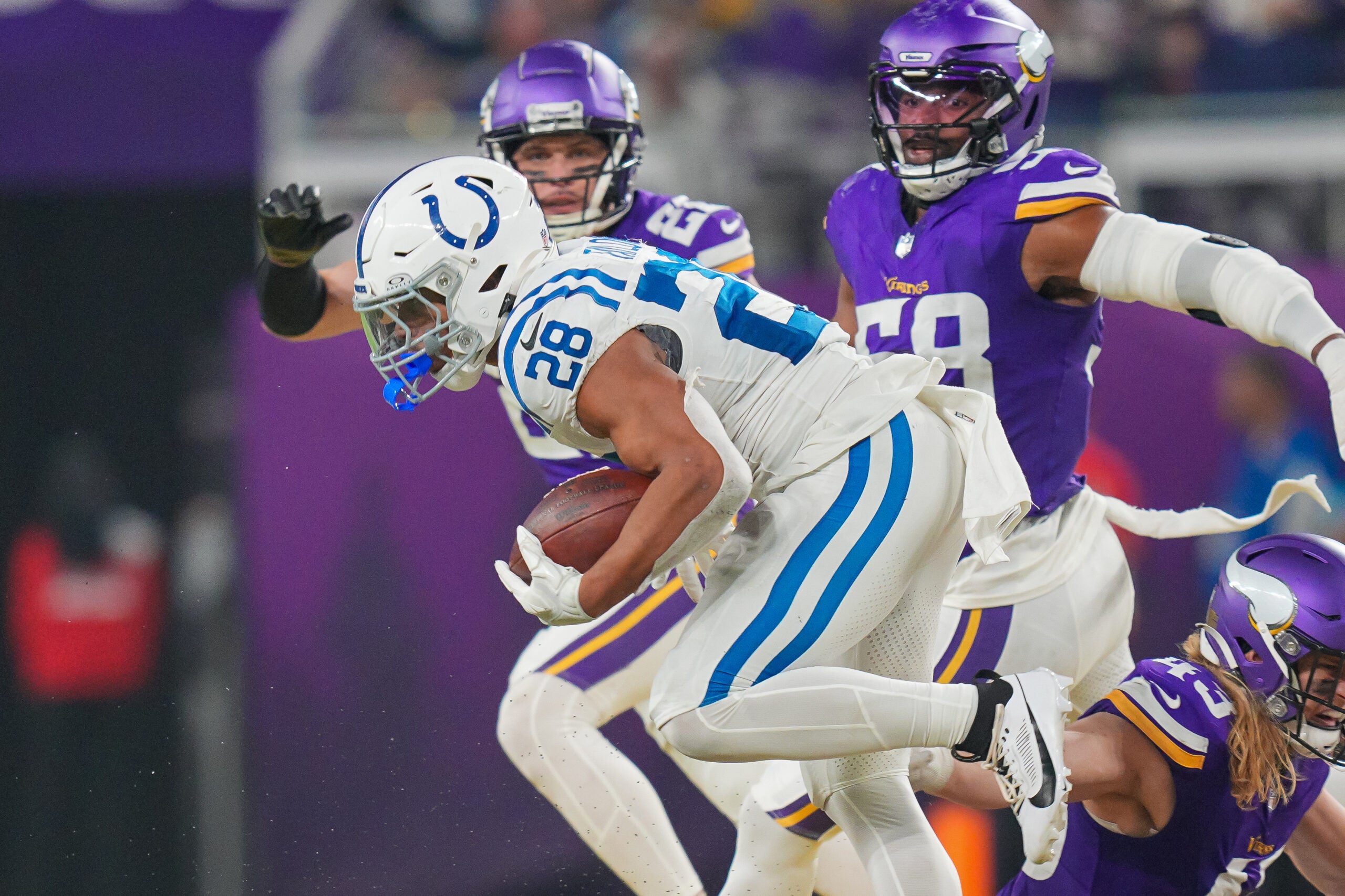 Nov 3, 2024; Minneapolis, Minnesota, USA; Indianapolis Colts running back Jonathan Taylor (28) runs with the ball against the Minnesota Vikings in the fourth quarter at U.S. Bank Stadium.