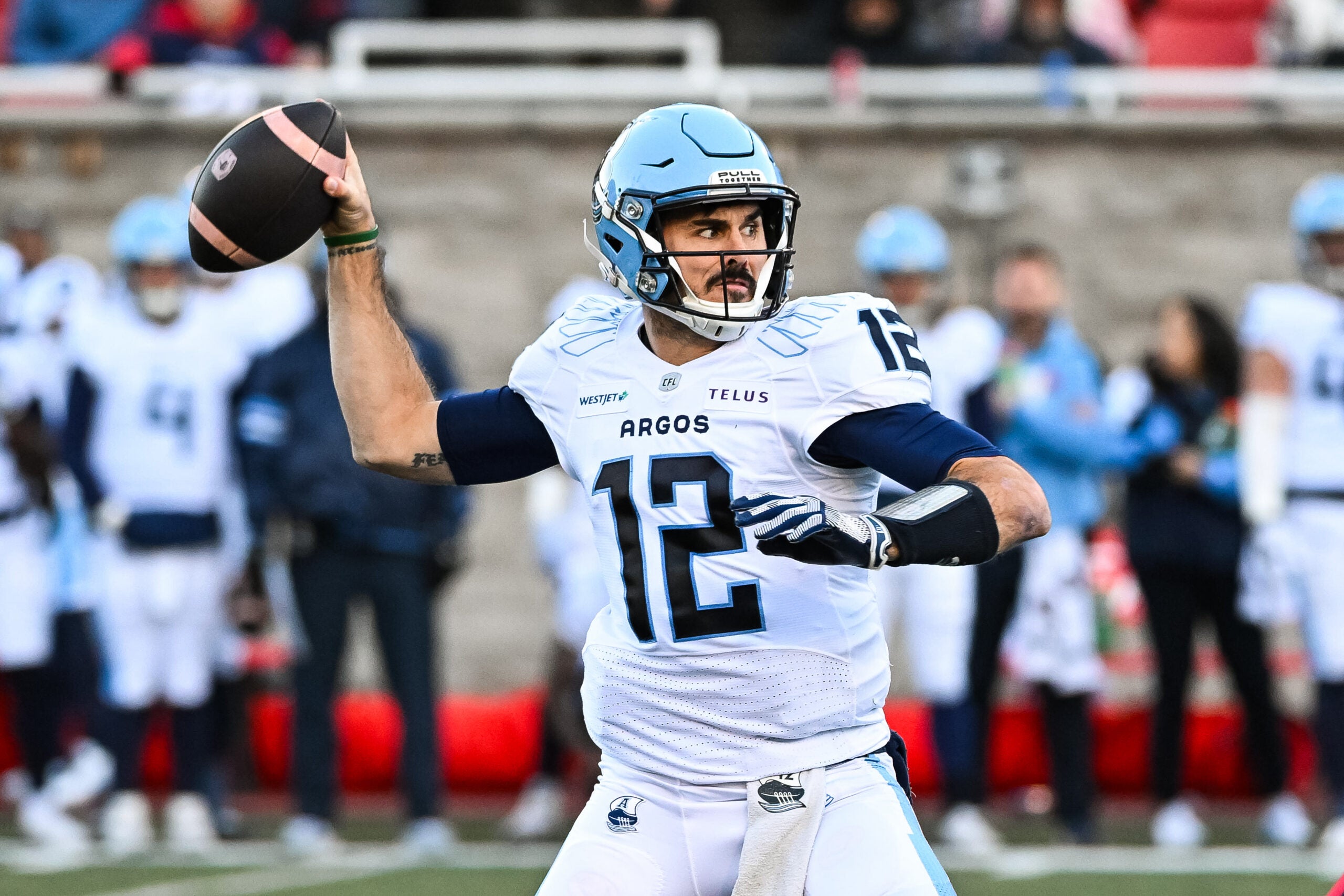 Nov 9, 2024; Montreal, Quebec, CAN; Toronto Argonauts quarterback Chad Kelly (12) passes the ball against the Montreal Alouettes during the first quarter at Percival-Molson Memorial Stadium.