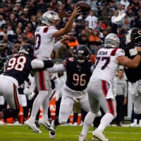 Nov 10, 2024; Chicago, Illinois, USA; New England Patriots quarterback Drake Maye (10) looks to pass against the Chicago Bears during the first half at Soldier Field.