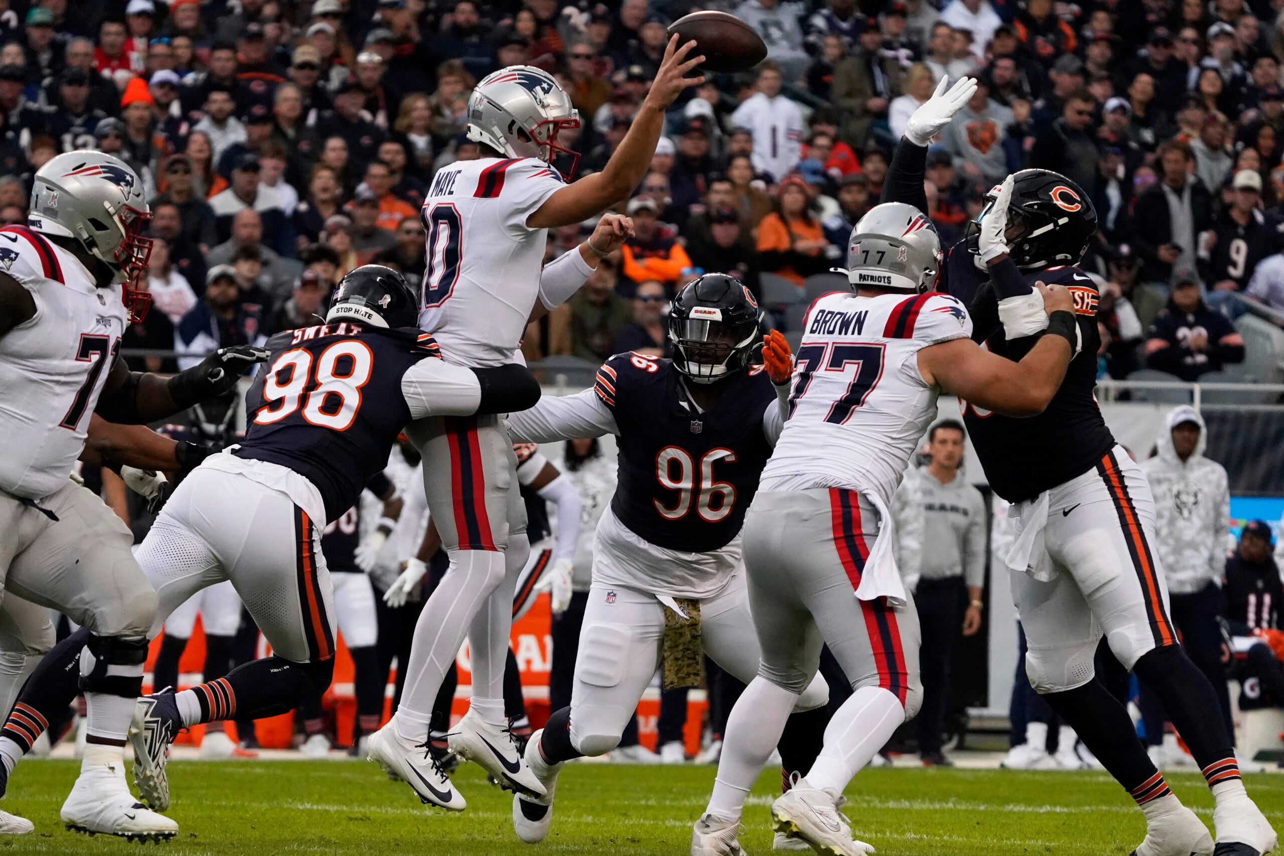Nov 10, 2024; Chicago, Illinois, USA; New England Patriots quarterback Drake Maye (10) looks to pass against the Chicago Bears during the first half at Soldier Field.