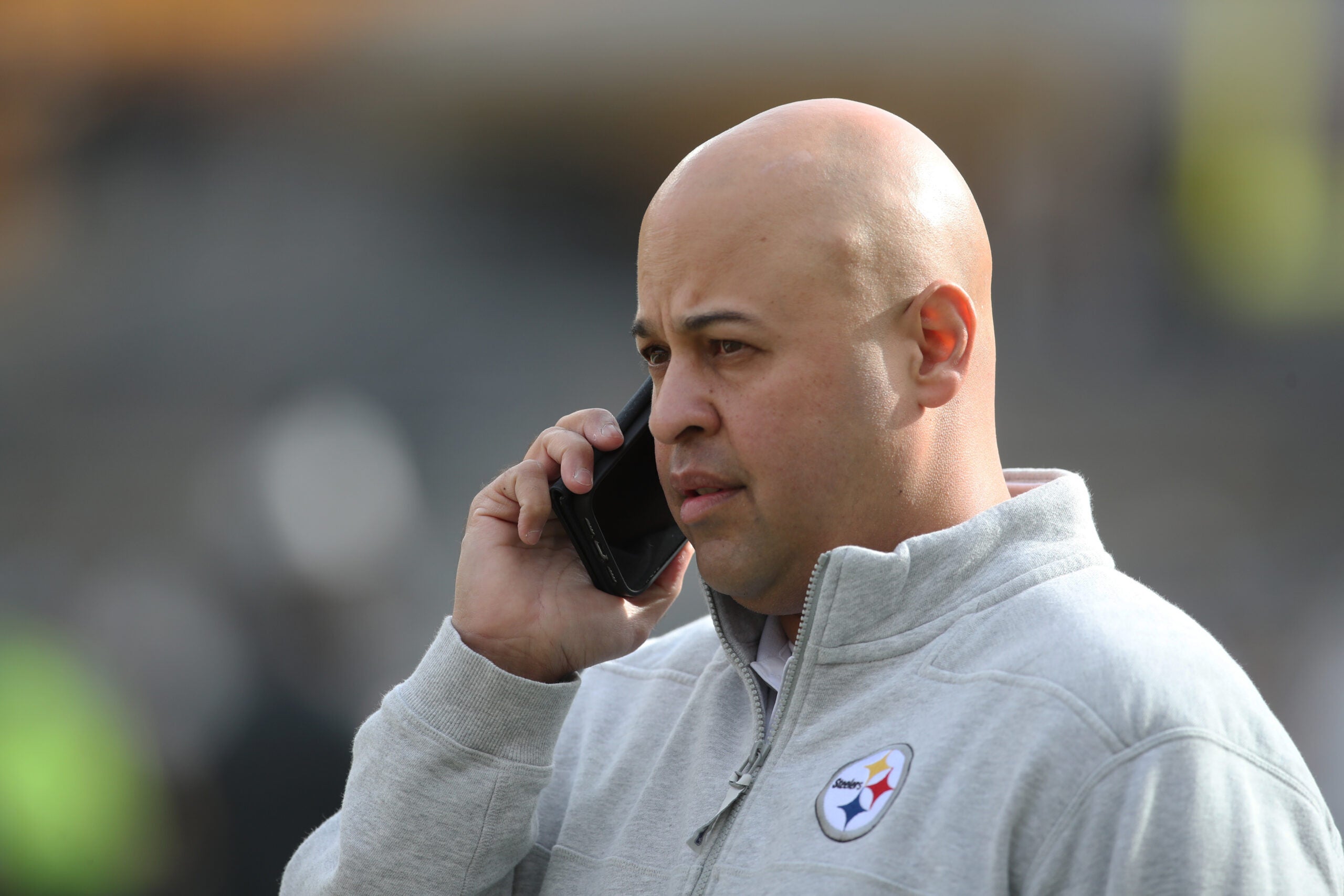Nov 17, 2024; Pittsburgh, Pennsylvania, USA; Pittsburgh Steelers general manager Omar Khan talks on the phone before the game against the Baltimore Ravens at Acrisure Stadium.