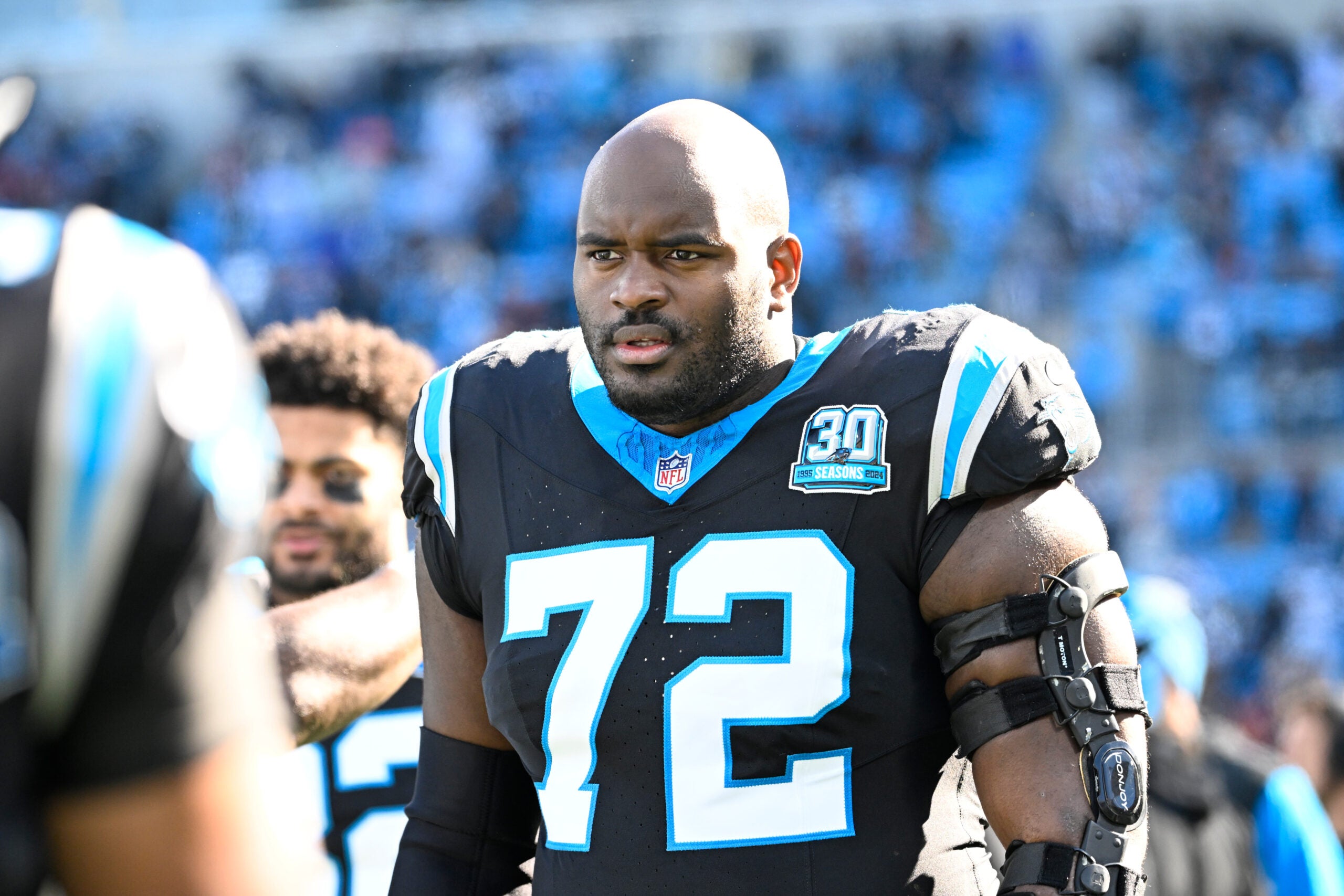 Dec 22, 2024; Charlotte, North Carolina, USA; Carolina Panthers offensive tackle Taylor Moton (72) on the sidelines before the game at Bank of America Stadium.