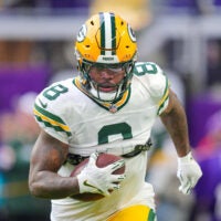 Dec 29, 2024; Minneapolis, Minnesota, USA; Green Bay Packers running back Josh Jacobs (8) warms up before the game against Minnesota Vikings at U.S. Bank Stadium.