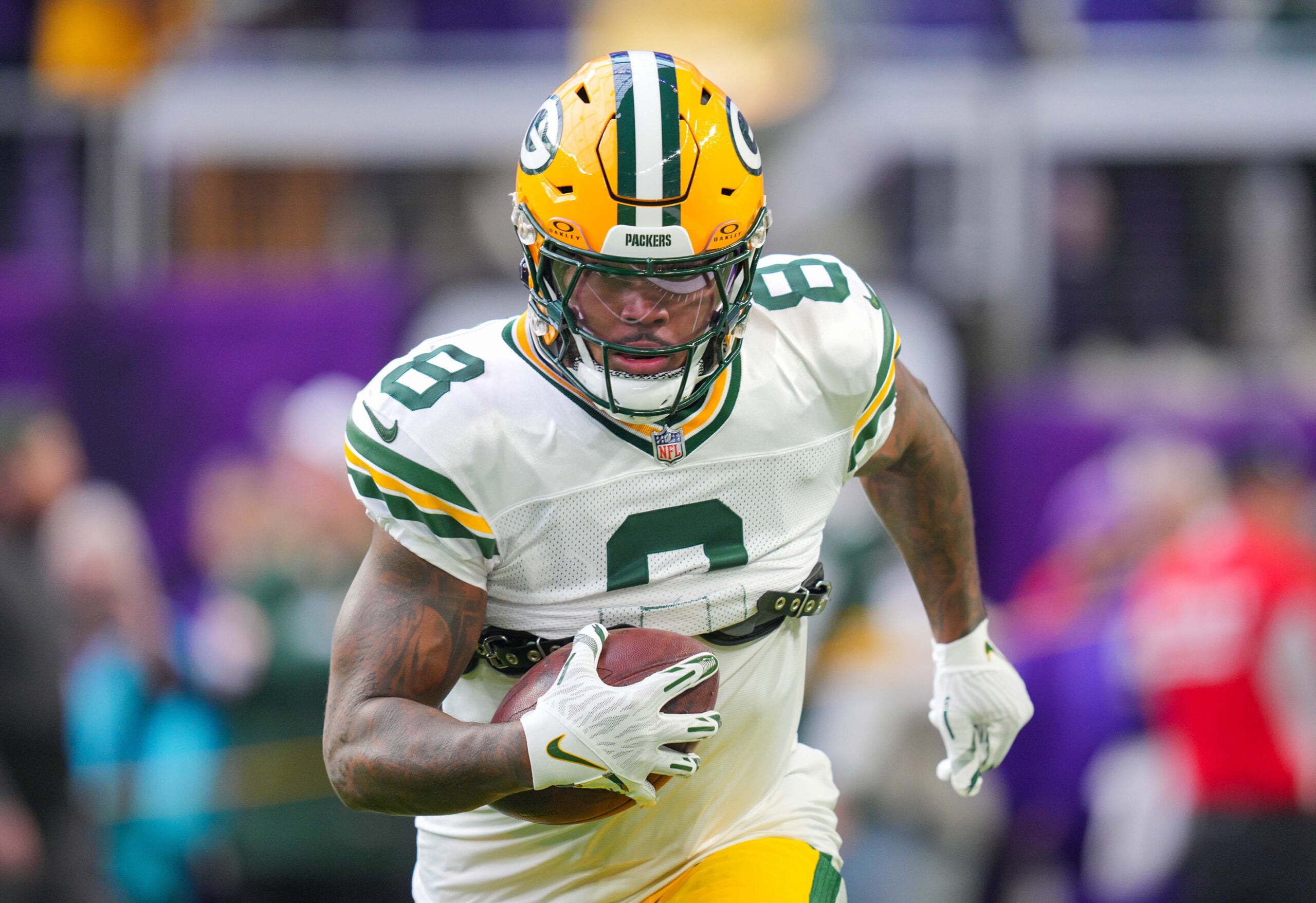 Dec 29, 2024; Minneapolis, Minnesota, USA; Green Bay Packers running back Josh Jacobs (8) warms up before the game against Minnesota Vikings at U.S. Bank Stadium.