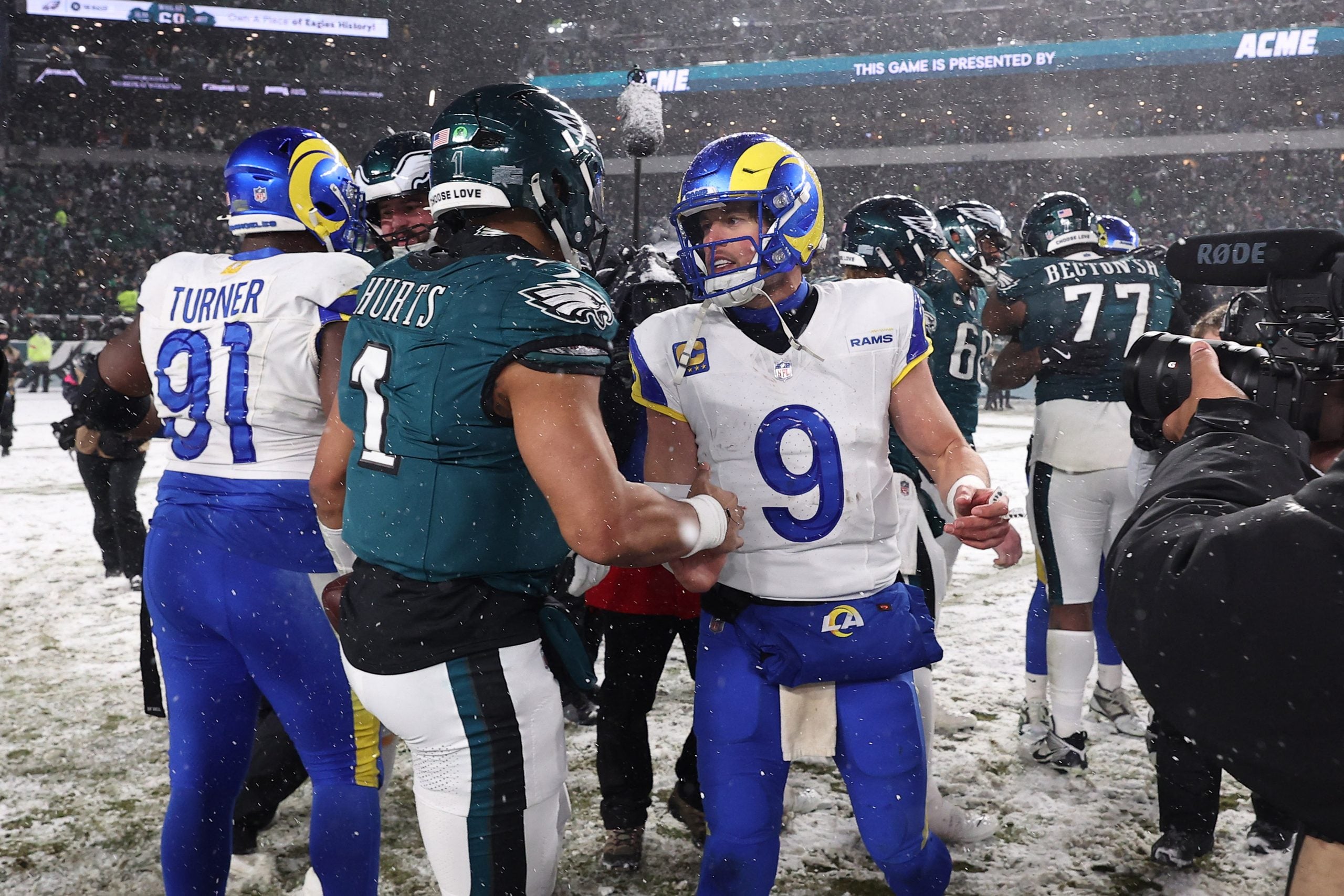 Jan 19, 2025; Philadelphia, Pennsylvania, USA; Philadelphia Eagles quarterback Jalen Hurts (1) greets Los Angeles Rams quarterback Matthew Stafford (9) after their game in a 2025 NFC divisional round game at Lincoln Financial Field.