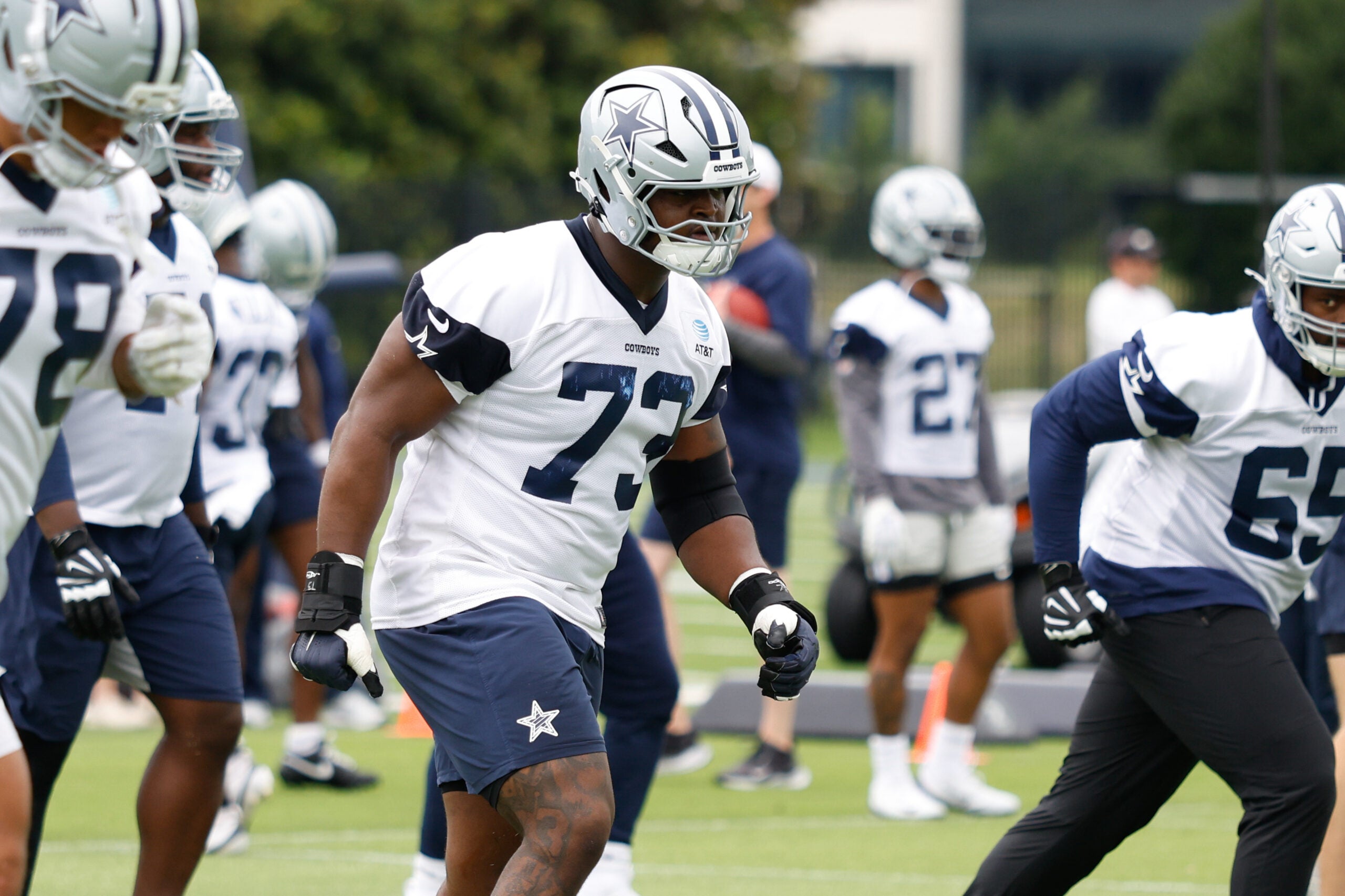 Jun 10, 2025; Arlington, TX, USA; Dallas Cowboys guard Tyler Smith (73) goes through a drill during practice at the Ford Center at the Star Training Facility in Frisco, Texas.