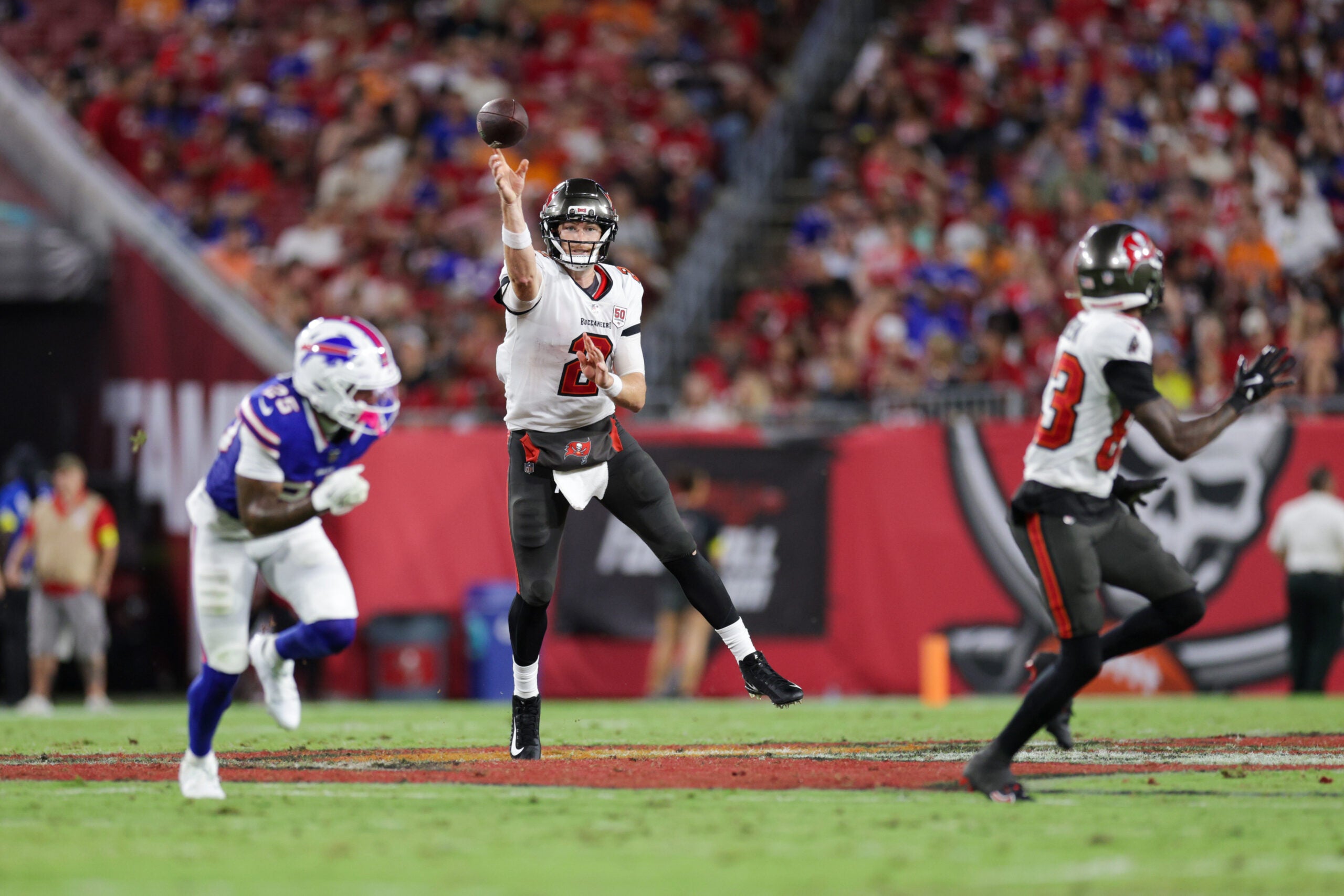 Aug 23, 2025; Tampa, Florida, USA; Tampa Bay Buccaneers quarterback Kyle Trask (2) throws a pass against the Buffalo Bills in the second quarter at Raymond James Stadium.
