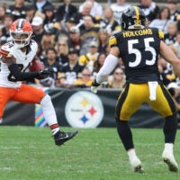 Oct 12, 2025; Pittsburgh, Pennsylvania, USA; Cleveland Browns wide receiver Gage Larvadain (84) runs after a catch as Pittsburgh Steelers linebacker Cole Holcomb (55) chases during the third quarter at Acrisure Stadium.