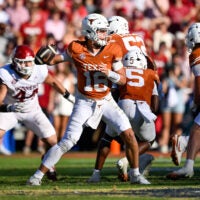 Oct 11, 2025; Dallas, Texas, USA; Texas Longhorns quarterback Arch Manning (16) looks to throw the ball during the game between the Texas Longhorns and the Oklahoma Sooners at the Cotton Bowl.