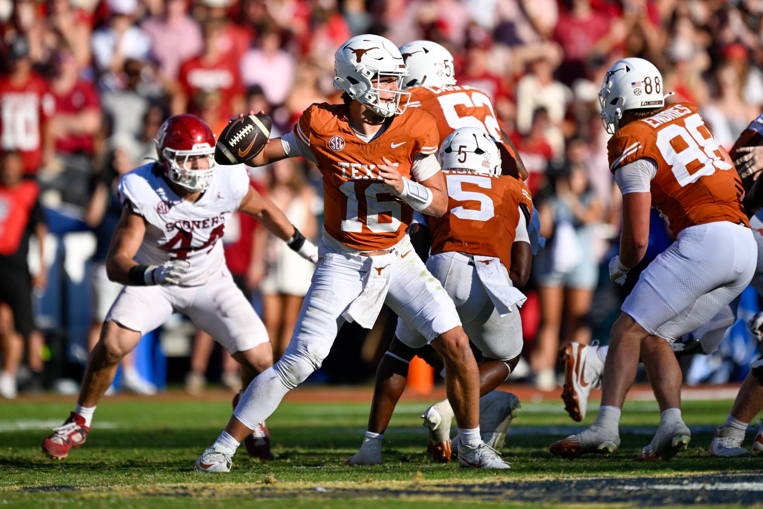 Oct 11, 2025; Dallas, Texas, USA; Texas Longhorns quarterback Arch Manning (16) looks to throw the ball during the game between the Texas Longhorns and the Oklahoma Sooners at the Cotton Bowl.
