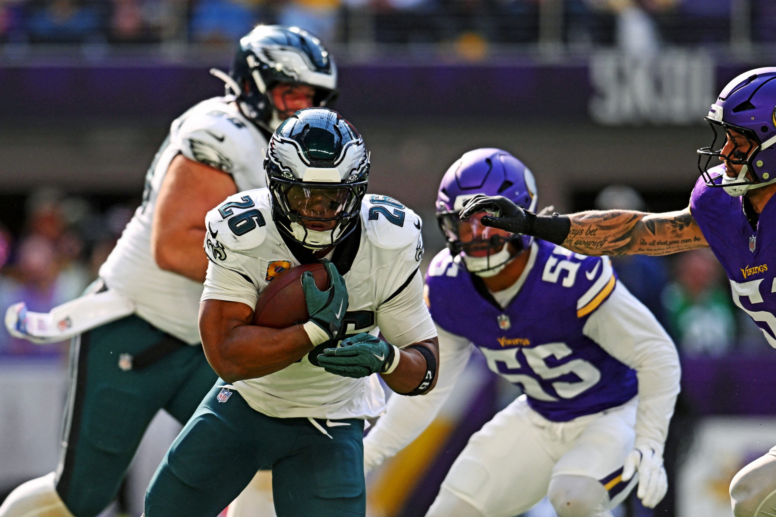 Oct 19, 2025; Minneapolis, Minnesota, USA; Philadelphia Eagles running back Saquon Barkley (26) controls the ball during the second half against the Minnesota Vikings at U.S. Bank Stadium.