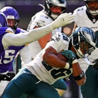Oct 19, 2025; Minneapolis, Minnesota, USA; Philadelphia Eagles running back Saquon Barkley (26) controls the ball during the second half against the Minnesota Vikings at U.S. Bank Stadium.