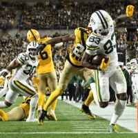 Oct 26, 2025; Pittsburgh, Pennsylvania, USA; Green Bay Packers wide receiver Savion Williams (83) scores a touchdown against Pittsburgh Steelers cornerback Darius Slay (23) during the third quarter at Acrisure Stadium.