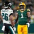 Nov 10, 2025; Green Bay, Wisconsin, USA; Green Bay Packers defensive end Micah Parsons (1) talks with running back Saquon Barkley (26) during the game at Lambeau Field.