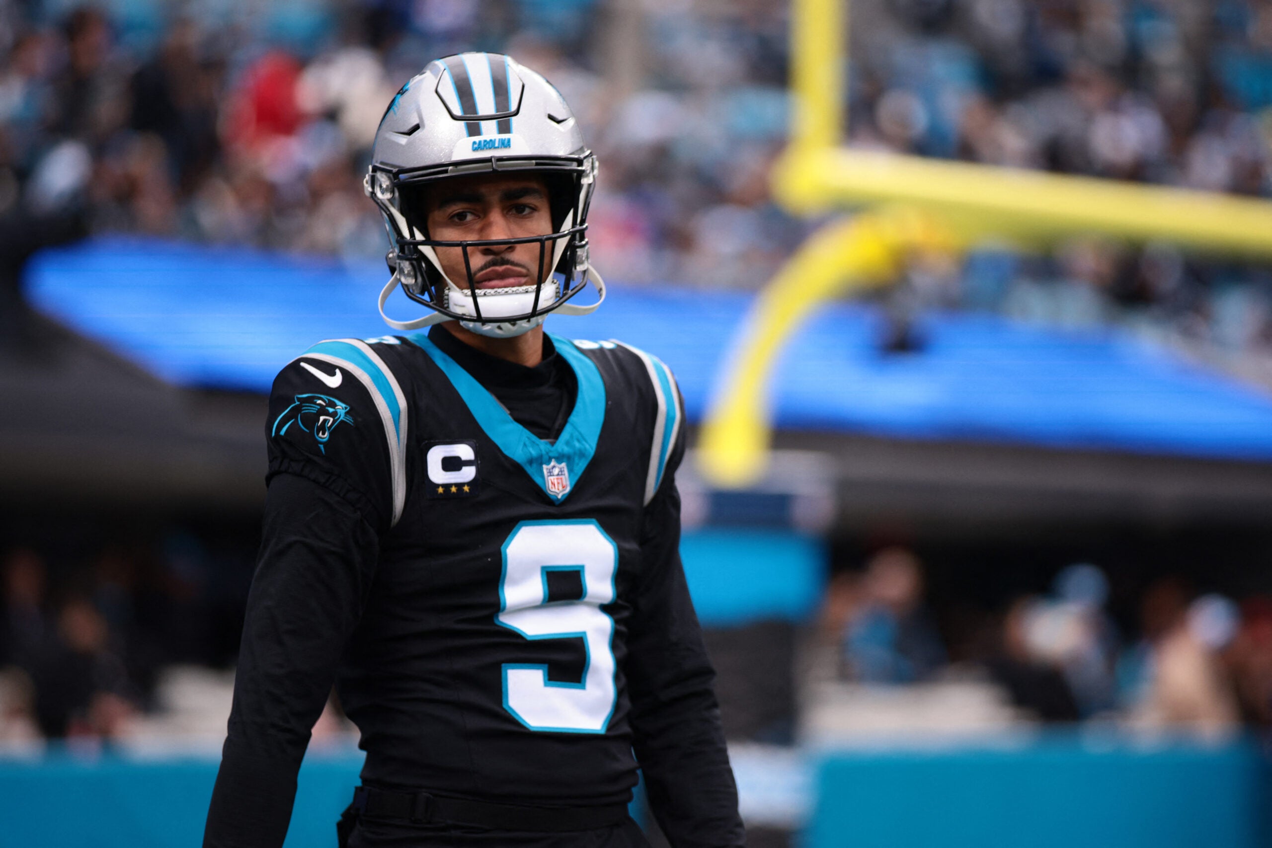 Nov 30, 2025; Charlotte, North Carolina, USA; Carolina Panthers quarterback Bryce Young (9) looks on during the first quarter against the Los Angeles Rams at Bank of America Stadium.