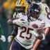 Chicago Bears running back Kyle Monangai (25) breaks out of a tackle by Green Bay Packers linebacker Edgerrin Cooper (56) on Sunday, December 7, 2025, at Lambeau Field in Green Bay, Wis. The Packers won the game, 28-21.