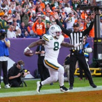 Dec 14, 2025; Denver, Colorado, USA; Green Bay Packers running back Josh Jacobs (8) reacts after a touchdown during the second quarter against the Denver Broncos at Empower Field at Mile High.