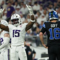 Dec 25, 2025; Minneapolis, Minnesota, USA; Minnesota Vikings linebacker Dallas Turner (15) celebrates after a play as Detroit Lions quarterback Jared Goff (16) reacts in the second half at U.S. Bank Stadium.