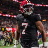Dec 29, 2025; Atlanta, Georgia, USA; Atlanta Falcons running back Bijan Robinson (7) reacts after catching a touchdown pass against the Los Angeles Rams during the first quarter at Mercedes-Benz Stadium.