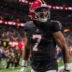 Dec 29, 2025; Atlanta, Georgia, USA; Atlanta Falcons running back Bijan Robinson (7) reacts after catching a touchdown pass against the Los Angeles Rams during the first quarter at Mercedes-Benz Stadium.