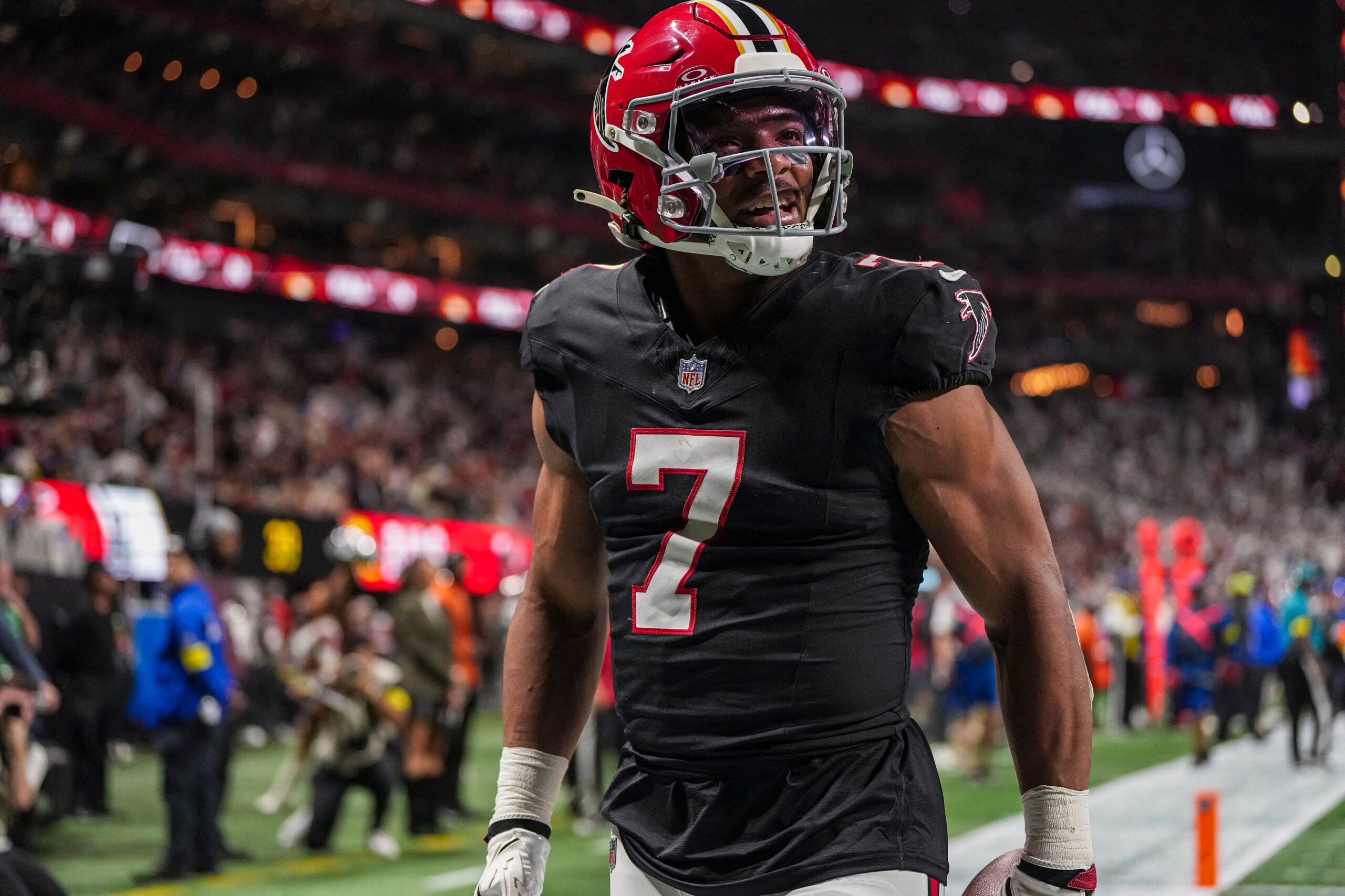 Dec 29, 2025; Atlanta, Georgia, USA; Atlanta Falcons running back Bijan Robinson (7) reacts after catching a touchdown pass against the Los Angeles Rams during the first quarter at Mercedes-Benz Stadium.