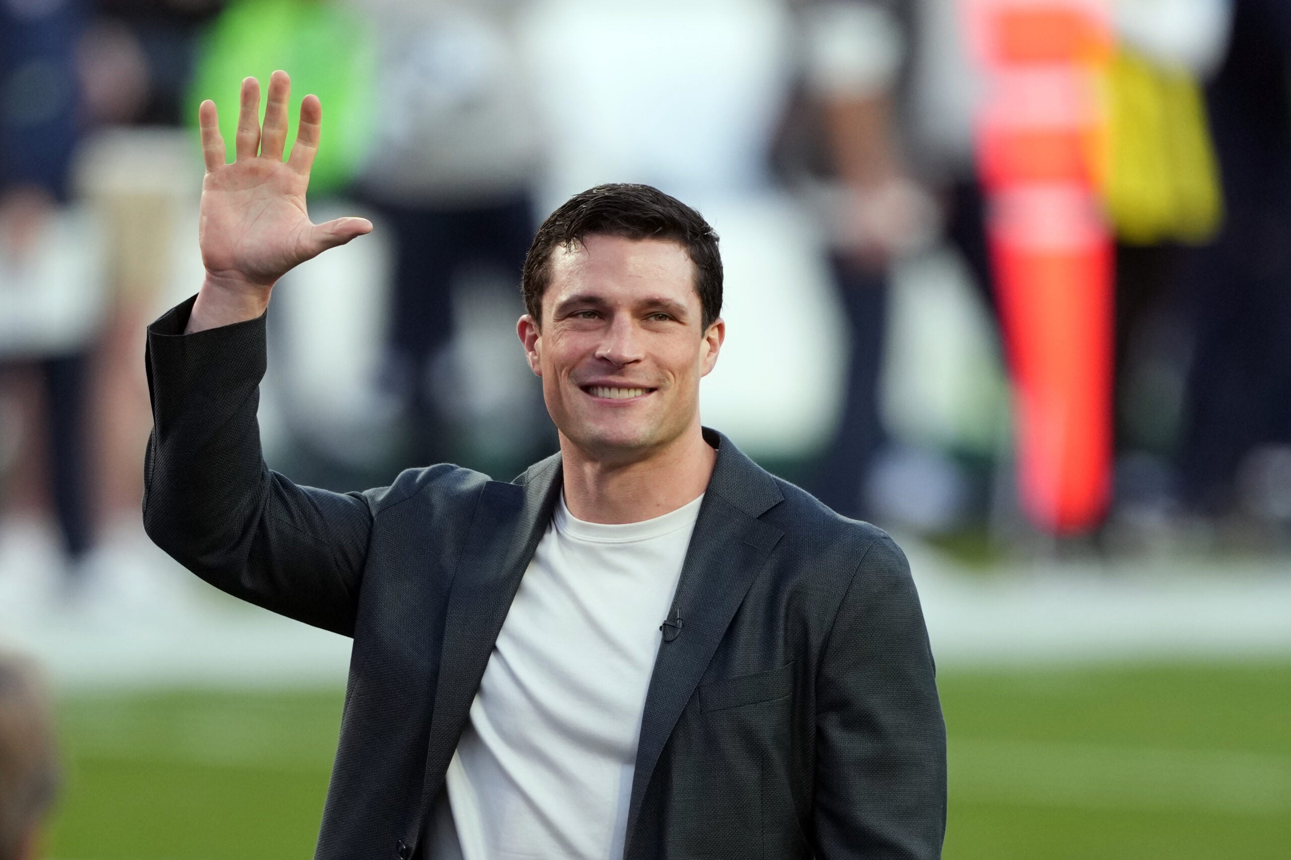 Feb 8, 2026; Santa Clara, CA, USA; Carolina Panthers former player Luke Kuechly stands on the field before the start of the second quarter in Super Bowl LX between the New England Patriots and the Seattle Seahawks at Levi's Stadium.