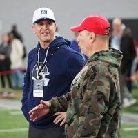 New York Giants head coach John Harbaugh talks to Ohio State associate athletic director for football sports performance Mickey Marotti during Pro Day for NFL scouts at the Woody Hayes Athletics Center on March 25, 2026.