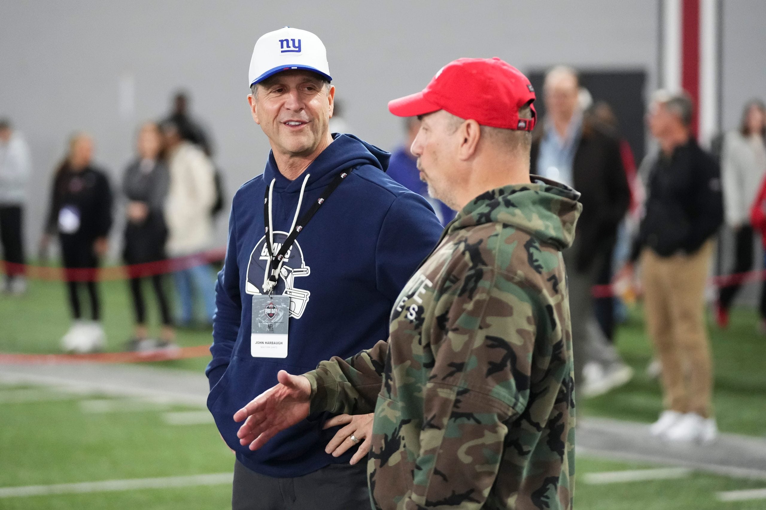 New York Giants head coach John Harbaugh talks to Ohio State associate athletic director for football sports performance Mickey Marotti during Pro Day for NFL scouts at the Woody Hayes Athletics Center on March 25, 2026.