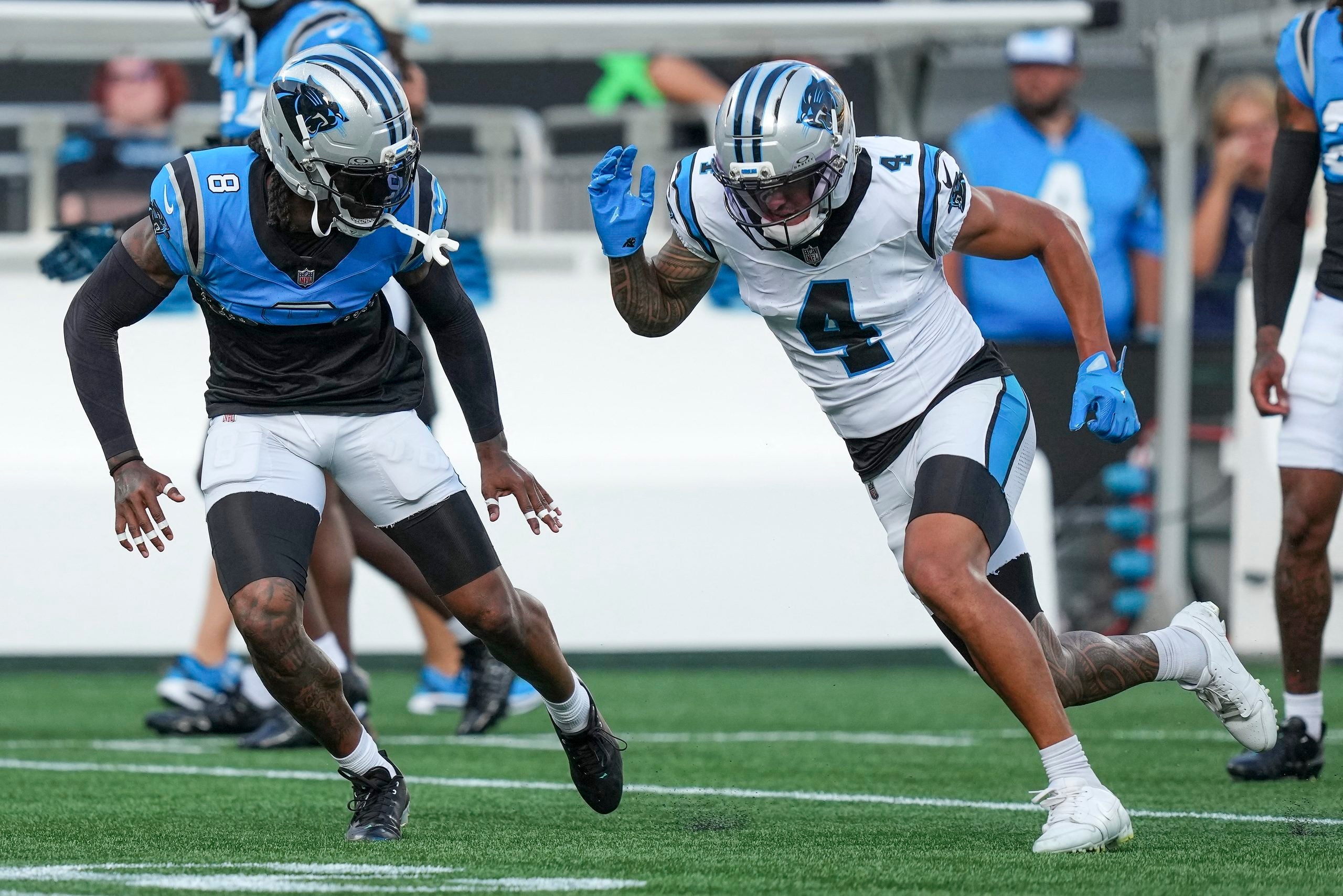 Jul 31, 2026; Charlotte, NC, USA; Carolina Panthers cornerback Jaycee Horn (8) covers Carolina Panthers wide receiver Tetairoa McMillan (4) during Fanfest at Bank of America Stadium.