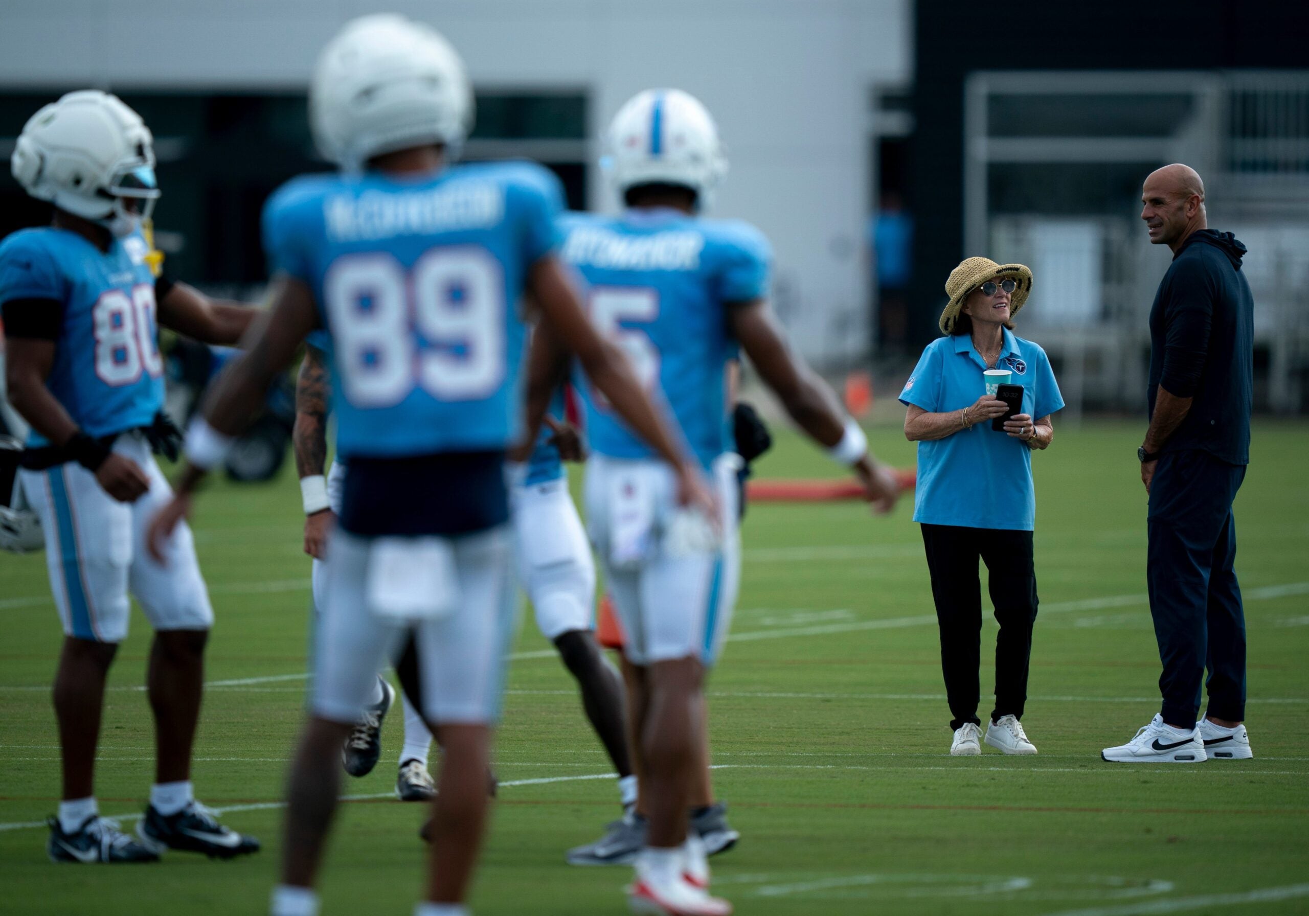 Tennessee Titans owner Amy Adams Strunk talks with Coach Robert Saleh during training camp at Vanderbilt Health Football Center Thursday, Aug. 6, 2026.