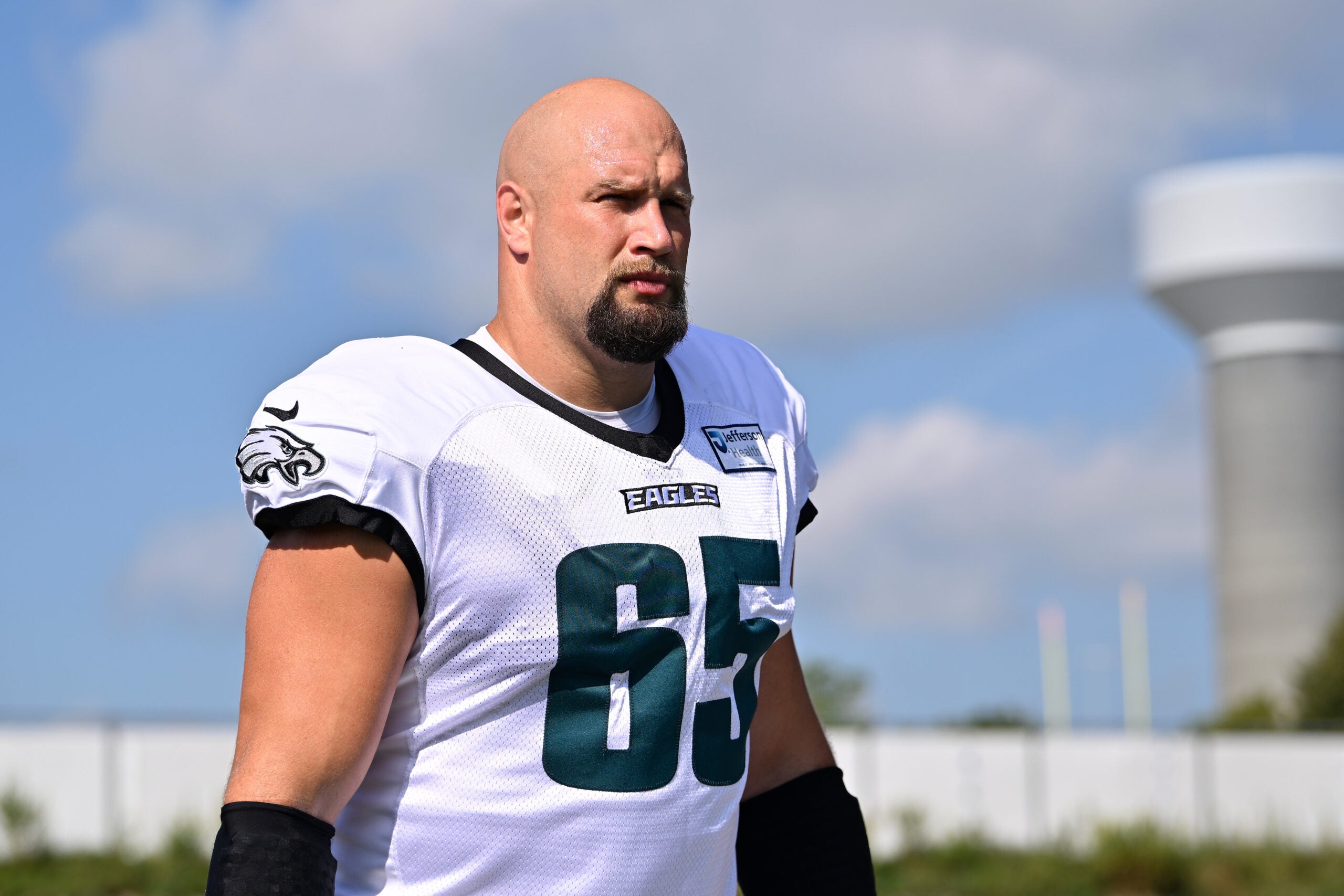 Aug 19, 2026; Foxborough, Massachusetts, USA; Philadelphia Eagles offensive tackle Lane Johnson (65) walks to the practice field during training camp at Gillette Stadium.