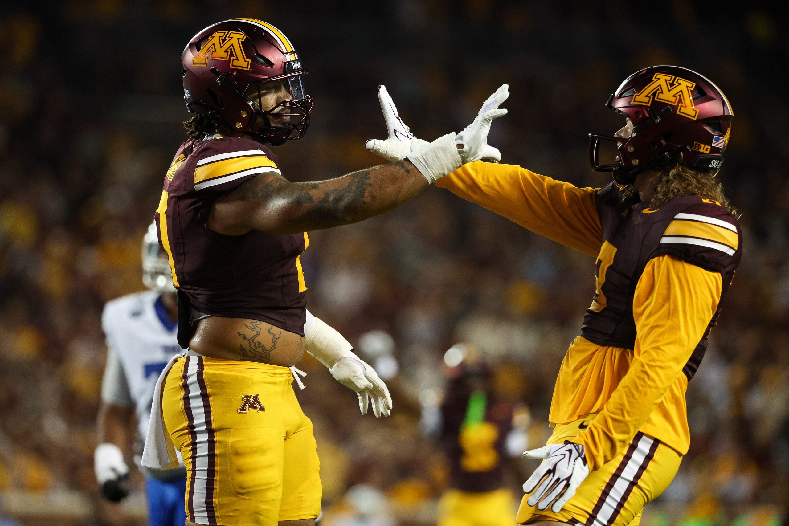 Sep 3, 2026; Minneapolis, Minnesota, USA; Minnesota Golden Gophers defensive lineman Anthony Smith (0) and defensive lineman TJ Bush Jr. (3) celebrate during the second half against the Eastern Illinois Panthers at Huntington Bank Stadium.