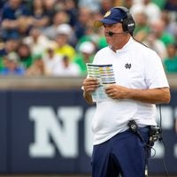 Sep 12, 2026; South Bend, Indiana, USA; Notre Dame Fighting Irish offensive coordinator Mike Denbrock watches from the sidelines against the Rice Owls during the second half at Notre Dame Stadium.