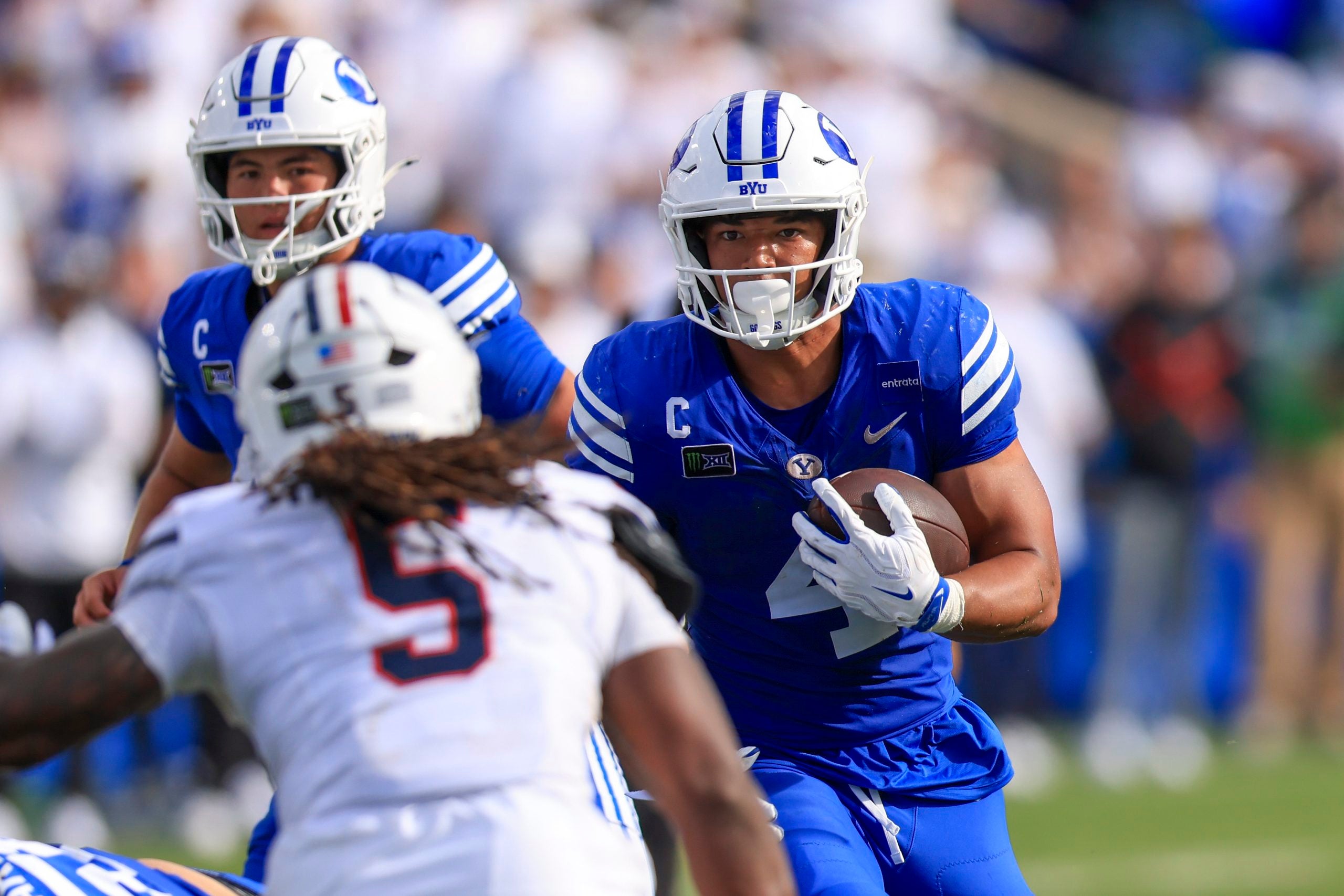 Sep 12, 2026; Provo, Utah, USA; BYU Cougars running back Lj Martin (4) runs the ball against the Arizona Wildcats during the second half at LaVell Edwards Stadium.