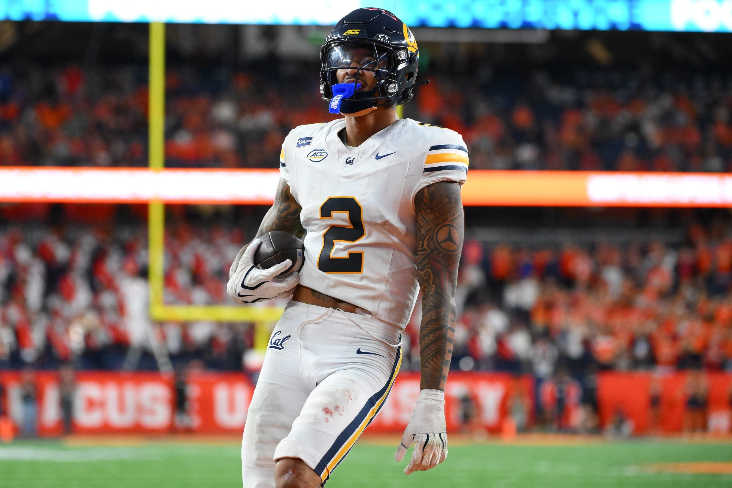 Sep 12, 2026; Syracuse, New York, USA; California Golden Bears defensive back Kingston Lopa (2) runs into the end zone for a touchdown following his interception during the second half against the Syracuse Orange at the JMA Wireless Dome.