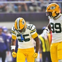 Sep 13, 2026; Minneapolis, Minnesota, USA; Green Bay Packers cornerback Keisean Nixon (25) and Green Bay Packers defensive end Barryn Sorrell (99) react after a play during the first half against the Minnesota Vikings at U.S. Bank Stadium.
