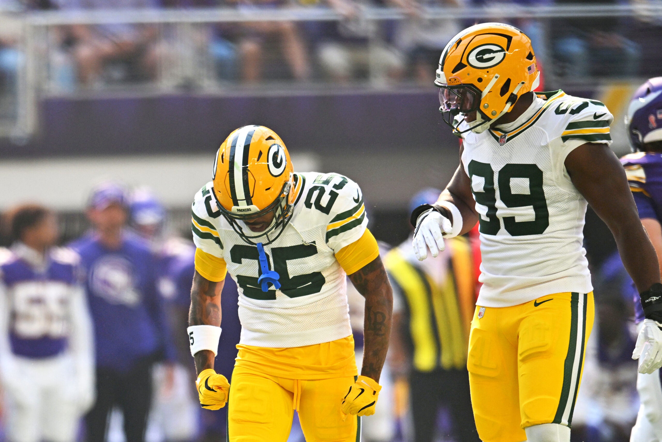 Sep 13, 2026; Minneapolis, Minnesota, USA; Green Bay Packers cornerback Keisean Nixon (25) and Green Bay Packers defensive end Barryn Sorrell (99) react after a play during the first half against the Minnesota Vikings at U.S. Bank Stadium.