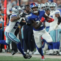 Sep 13, 2026; East Rutherford, New Jersey, USA; New York Giants wide receiver Malachi Fields (88) carries the ball defended by Dallas Cowboys linebacker Dee Winters (53) during the second quarter at MetLife Stadium.