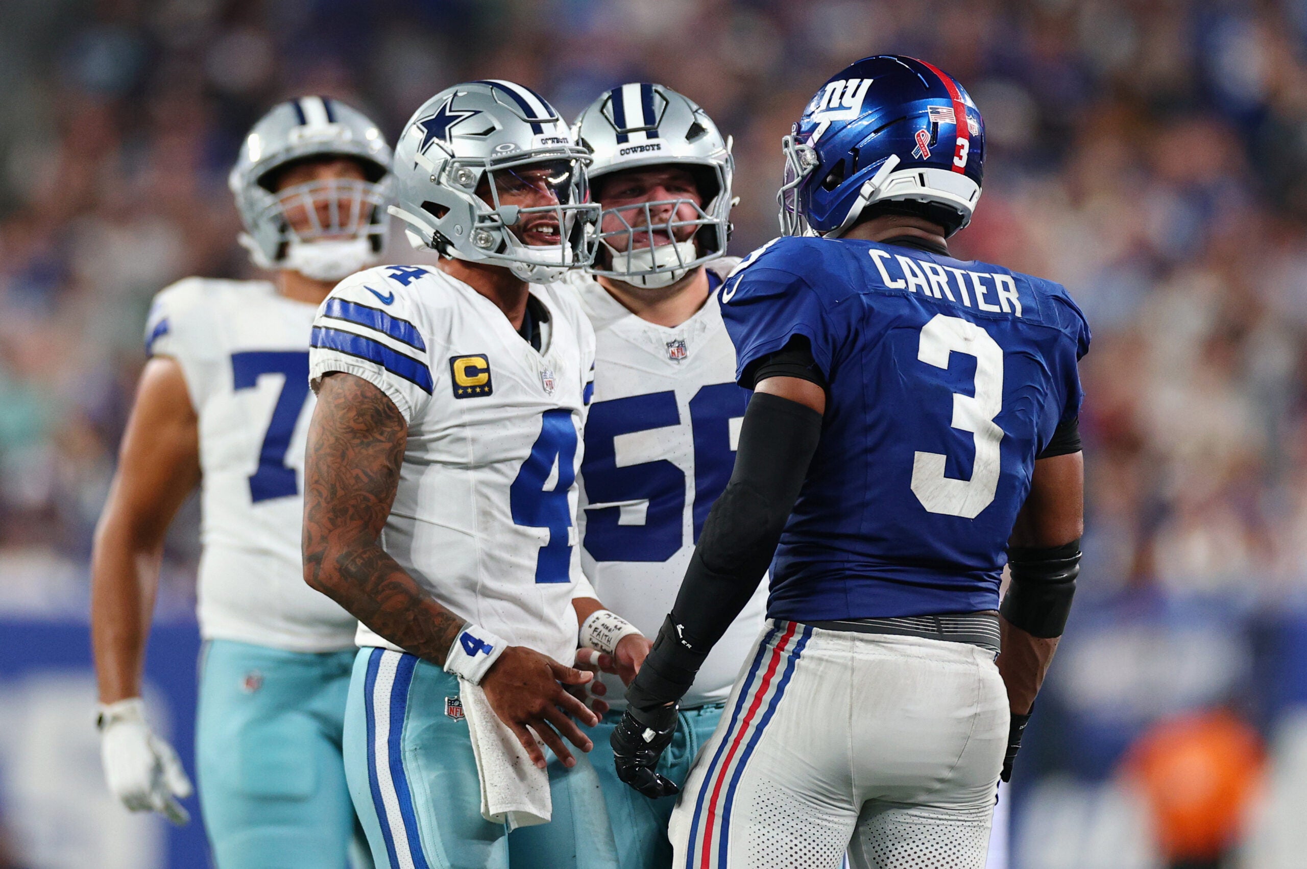 Sep 13, 2026; East Rutherford, New Jersey, USA; Dallas Cowboys quarterback Dak Prescott (4) speaks with New York Giants linebacker Abdul Carter (3) after a play during the third quarter at MetLife Stadium.