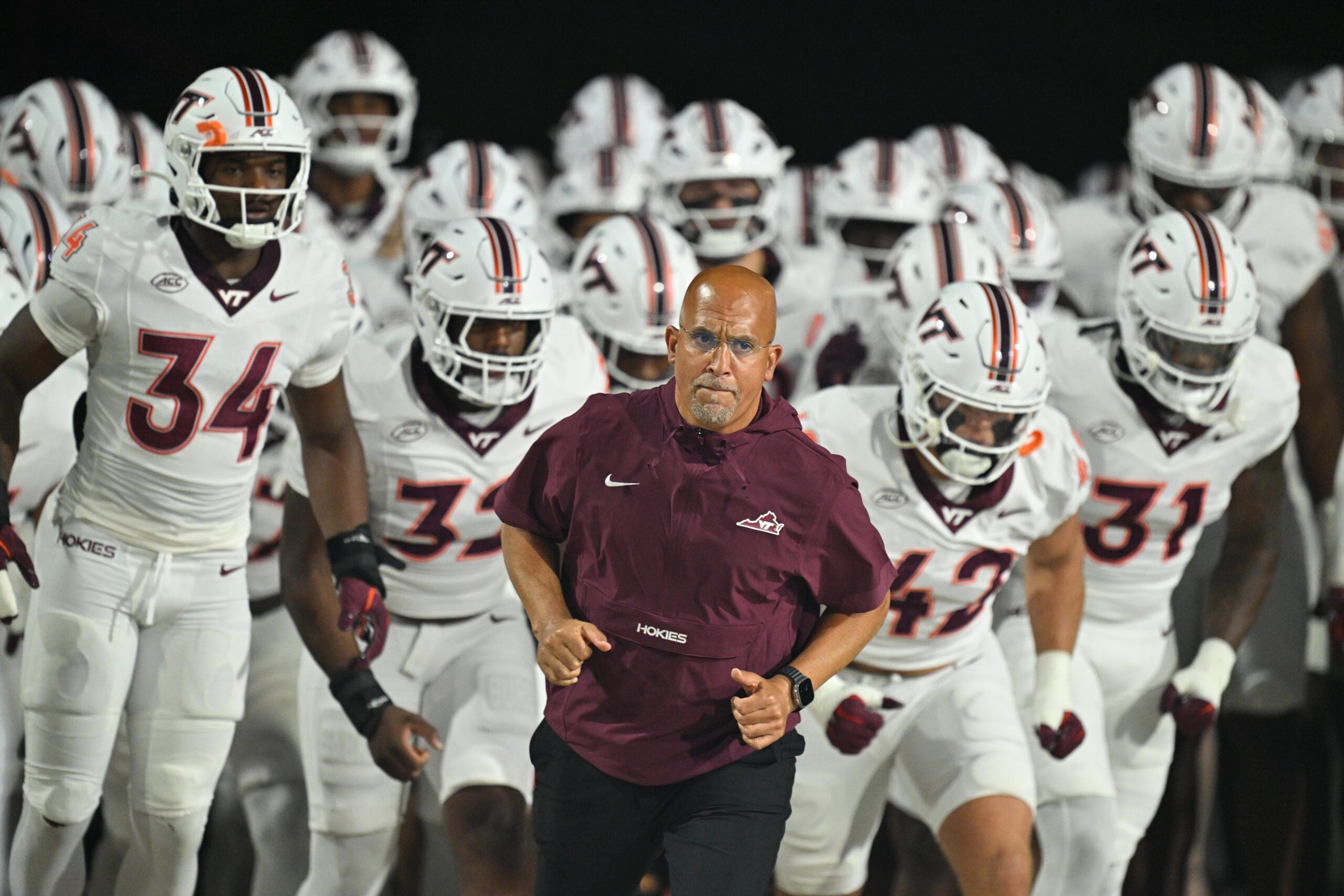 Sep 19, 2026; College Park, Maryland, USA; Virginia Tech Hokies head coach James Franklin leads his team onto the field before their game against the Maryland Terrapins at SECU Stadium.