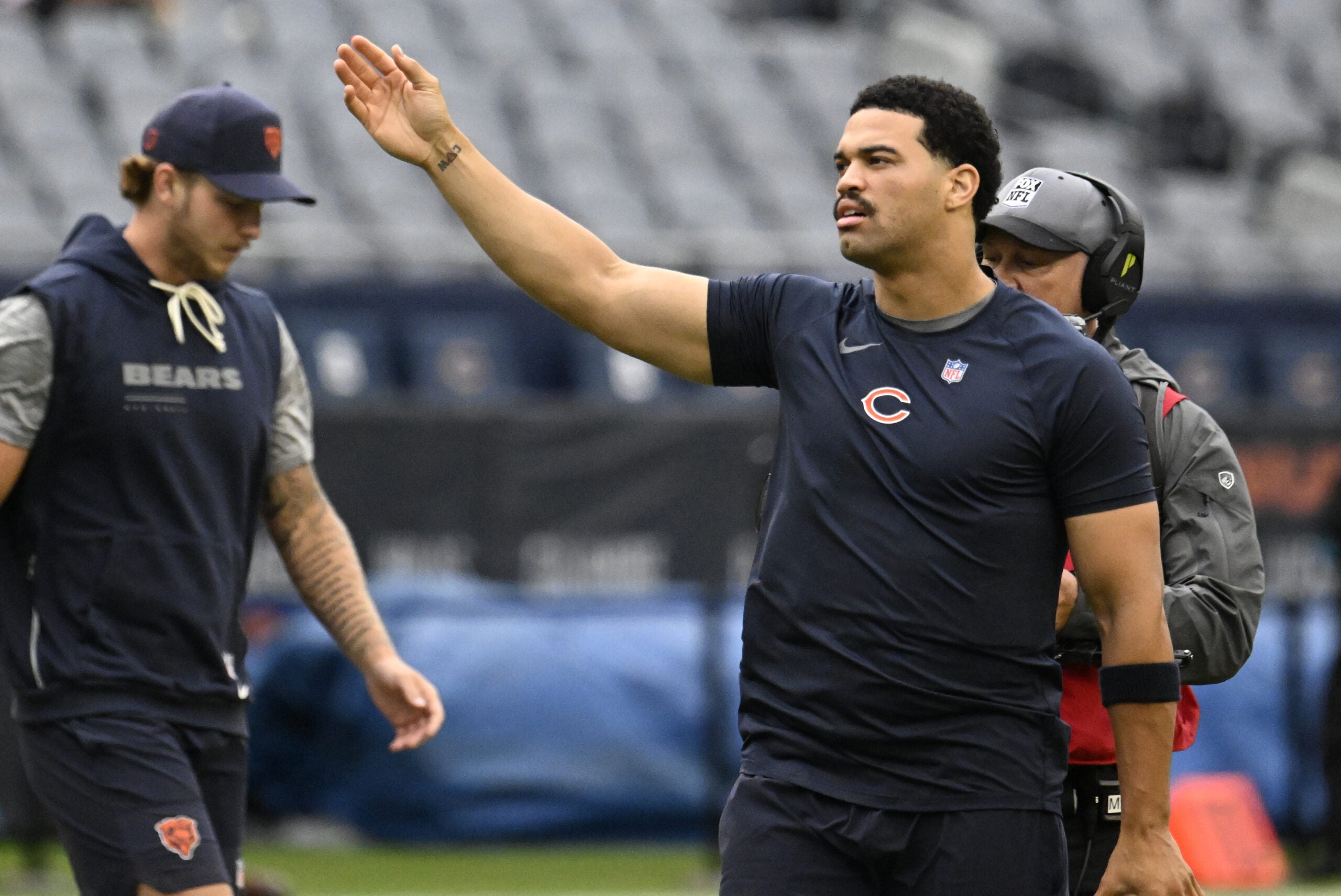Sep 20, 2026; Chicago, Illinois, USA; Chicago Bears quarterback Caleb Williams (18) tests the wind during warmups before a game against the Minnesota Vikings at Soldier Field.
