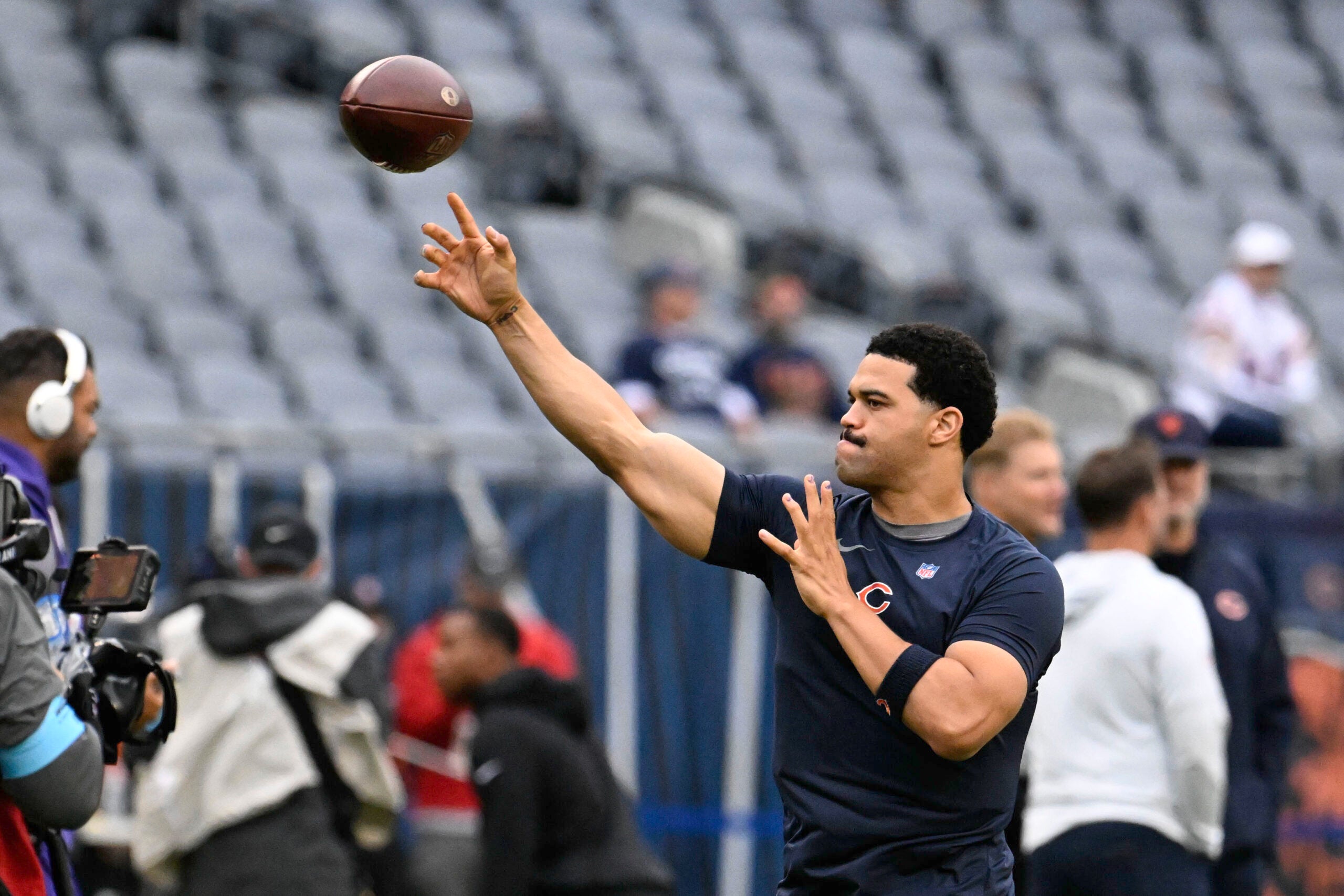 Sep 20, 2026; Chicago, Illinois, USA; Chicago Bears quarterback Caleb Williams (18) passes the ball during warmups before the game against the Minnesota Vikings at Soldier Field.